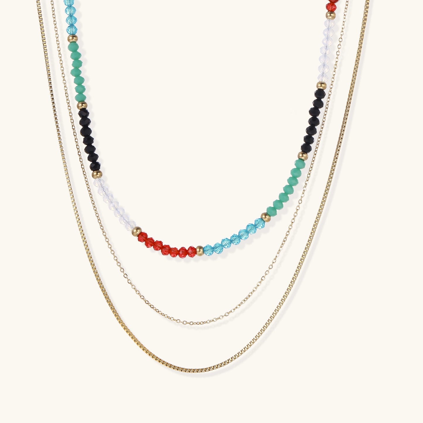 Layered gold-plated necklace set featuring colorful crystal beads in turquoise, green, black, red, and clear tones