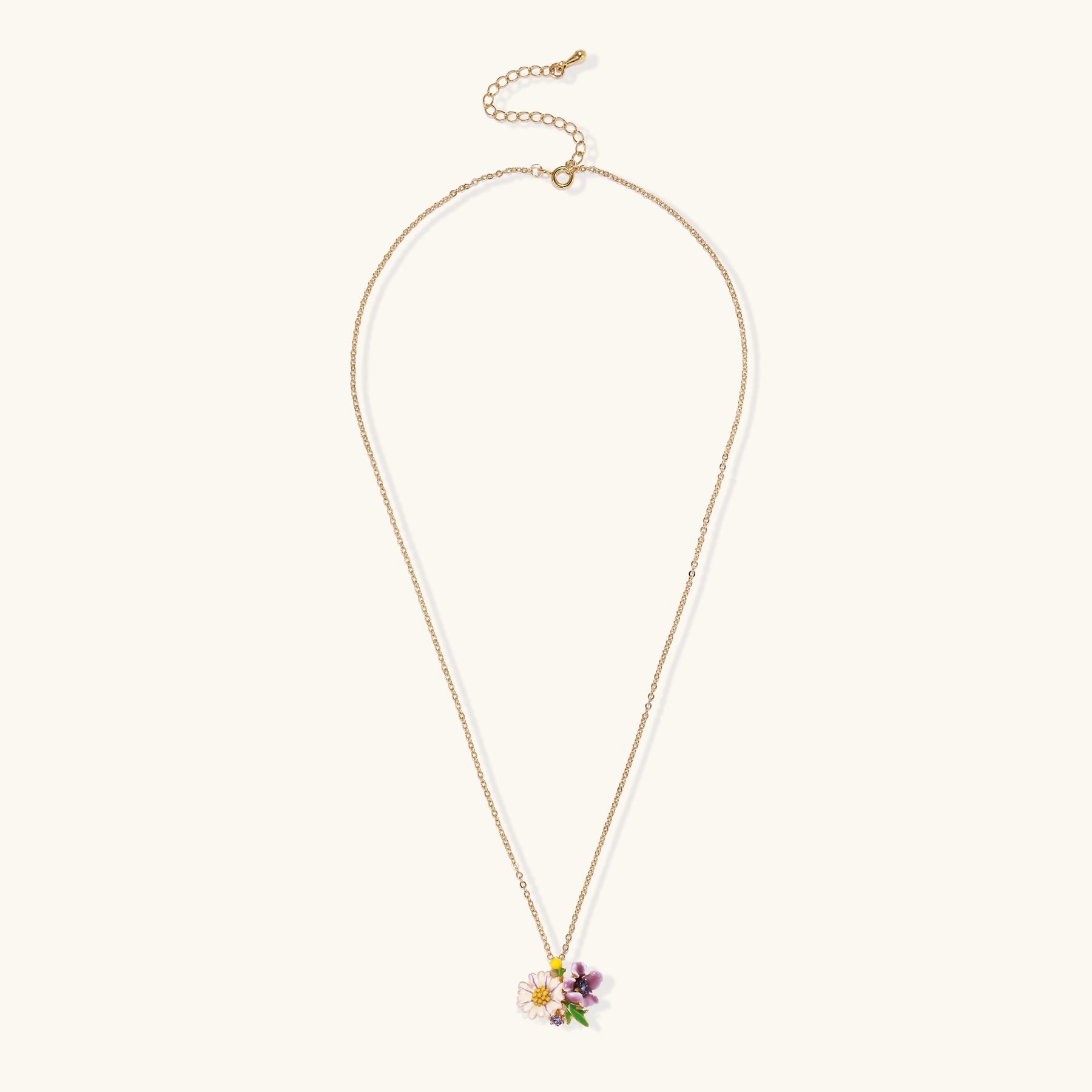 Delicate 18K gold plated necklace featuring colorful enamel flowers in pink and white with green leaves on chain