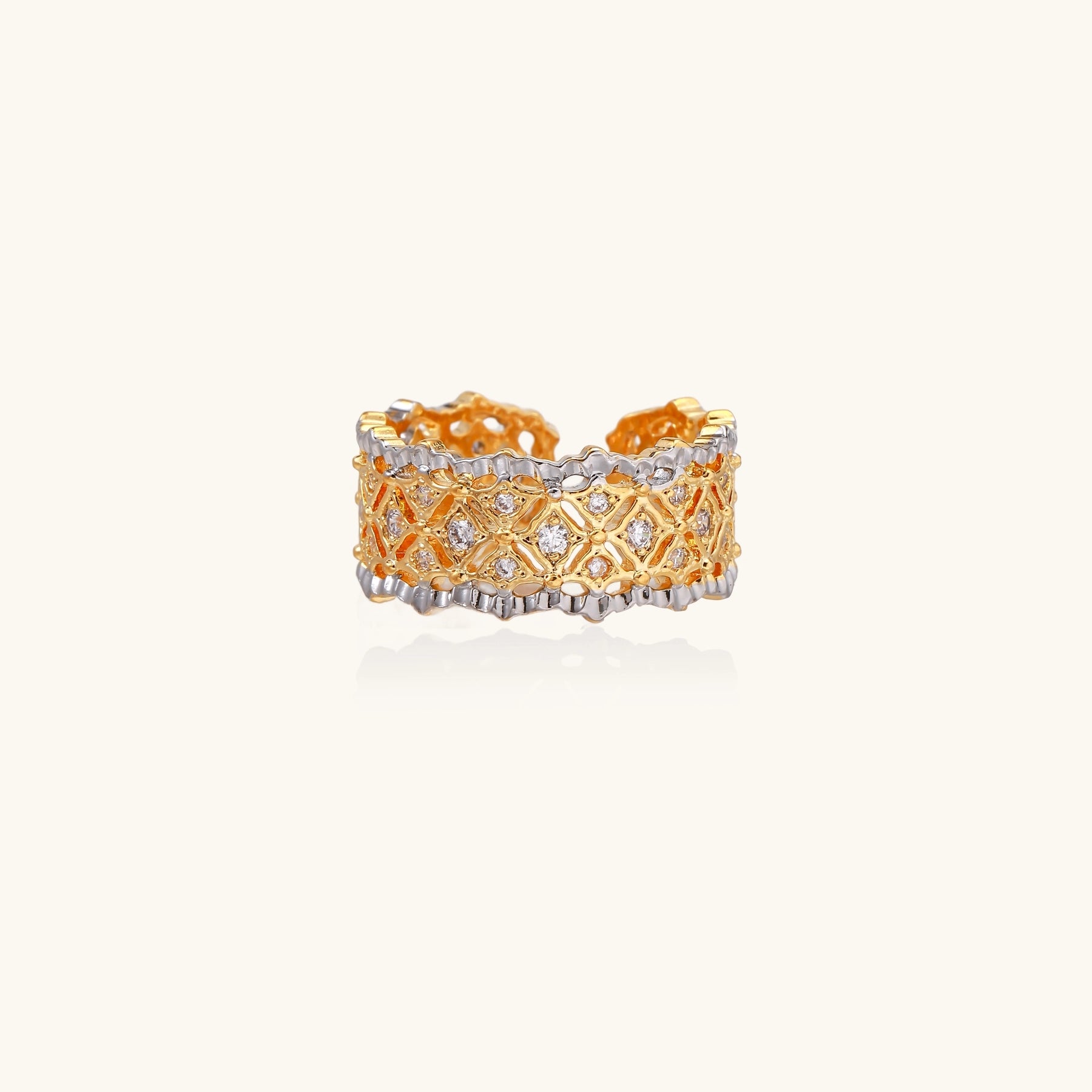 Bold geometric ring with lattice pattern in gold-plated brass featuring multiple tiers of sparkling zirconia stones